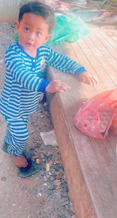 Toddler standing outside to calm down after a public tantrum.