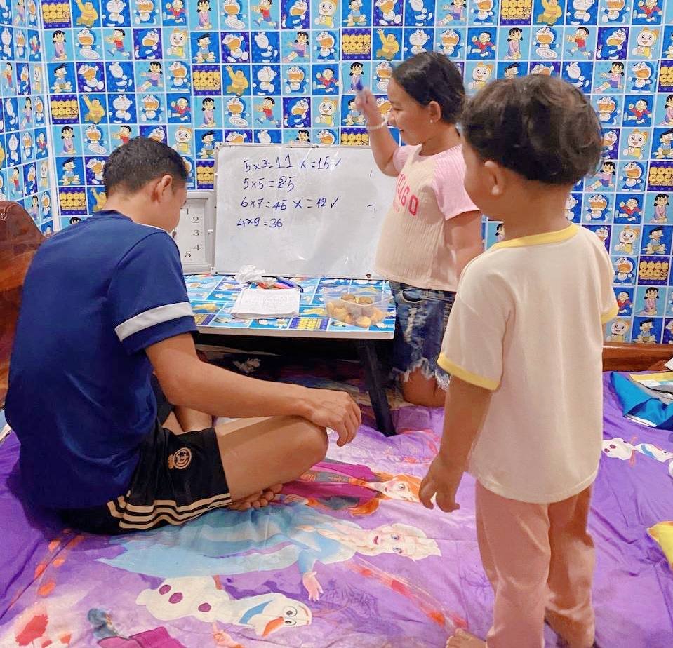 Happy 2nd grade student celebrating finishing her math homework.