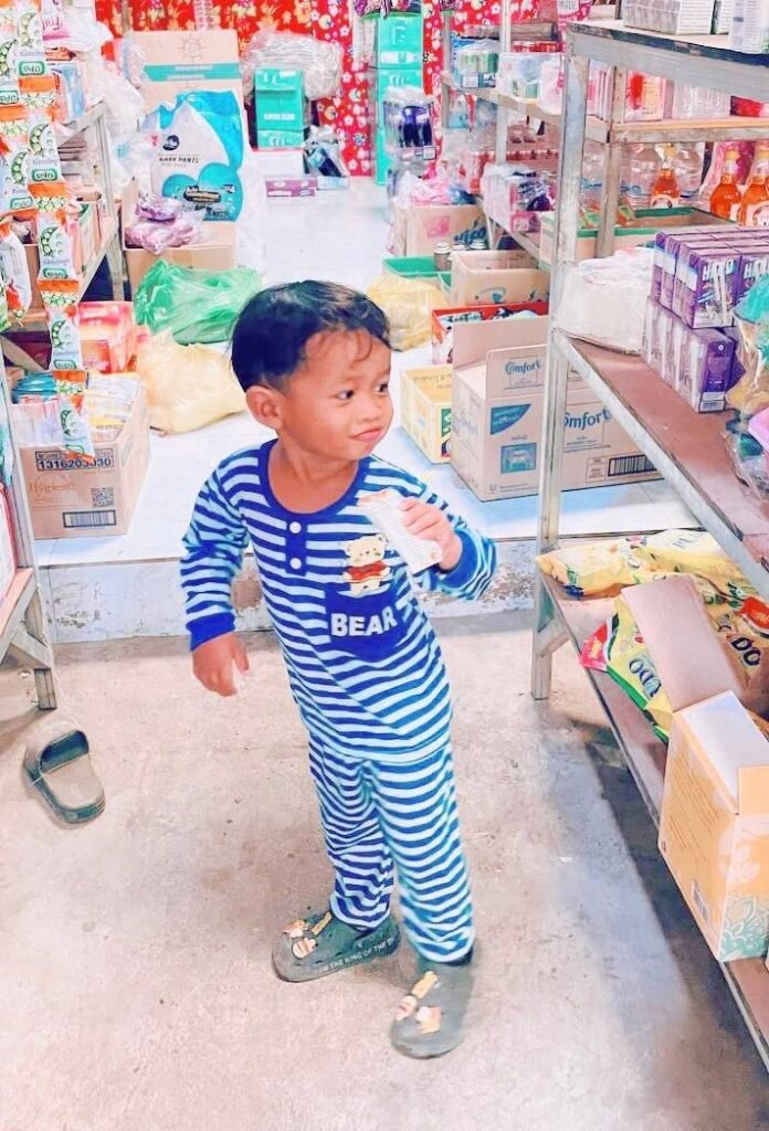 Happy toddler holding a snack after resolving a temper tantrum.
