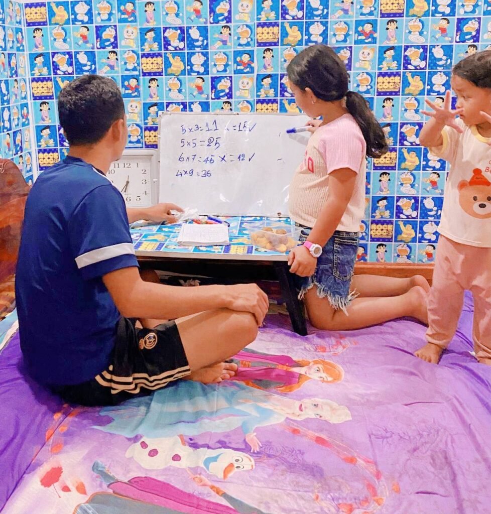 Real life example of homework distractions with younger siblings playing during study time.