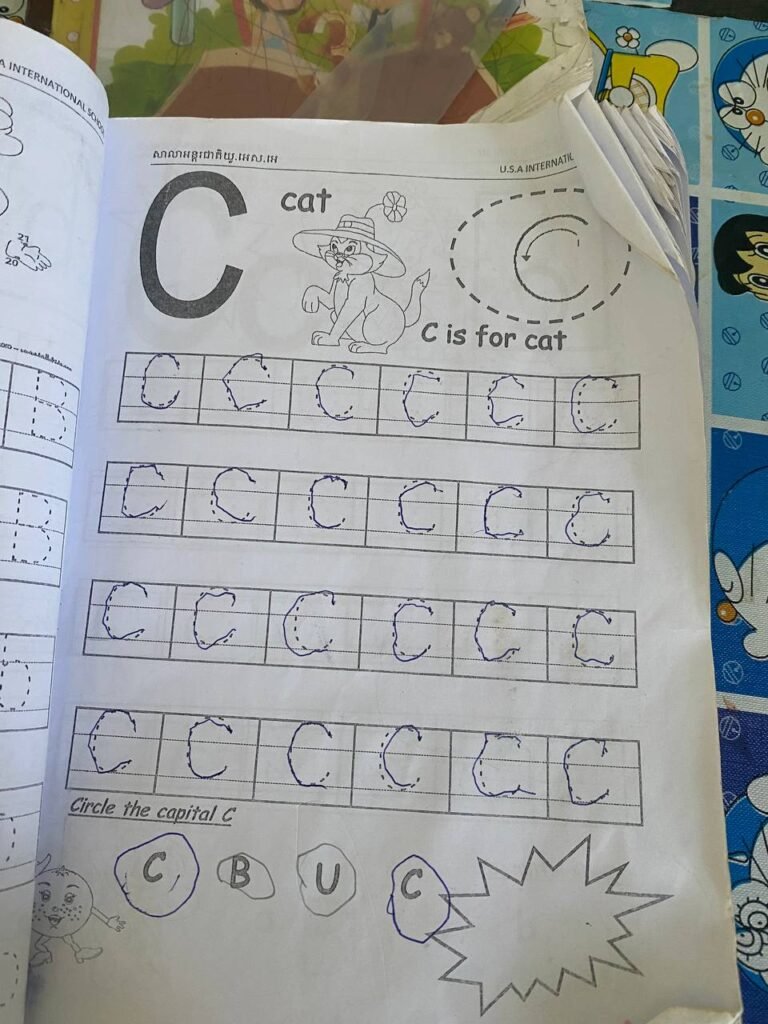 Completed letter C tracing worksheet showing neat handwriting progress in international school curriculum.